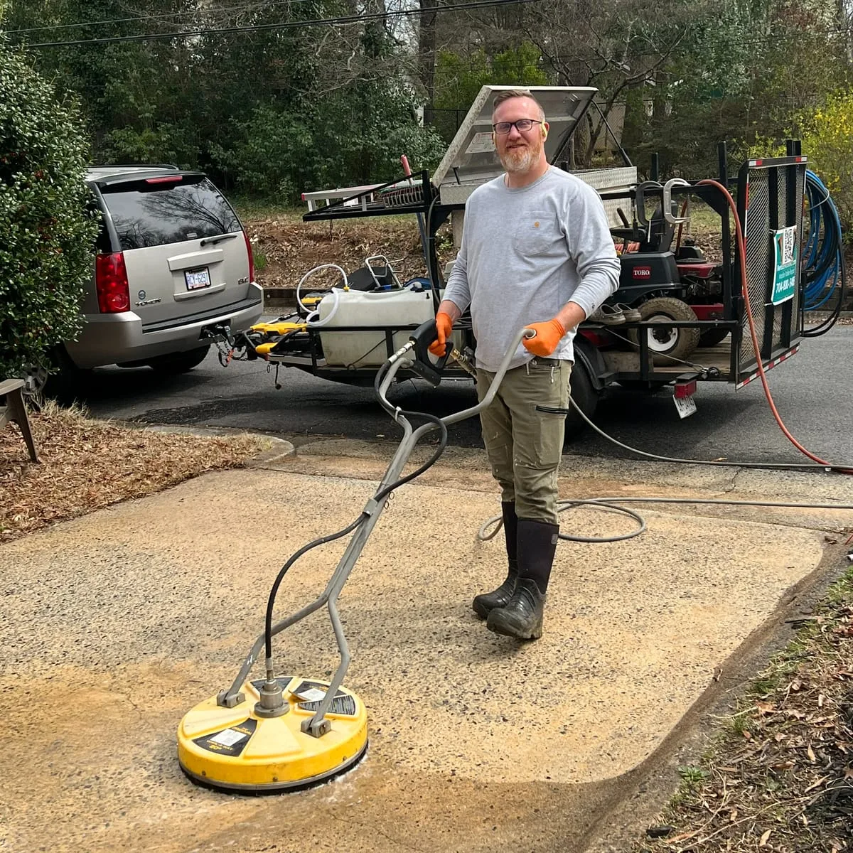 Technician with pressure washing rig