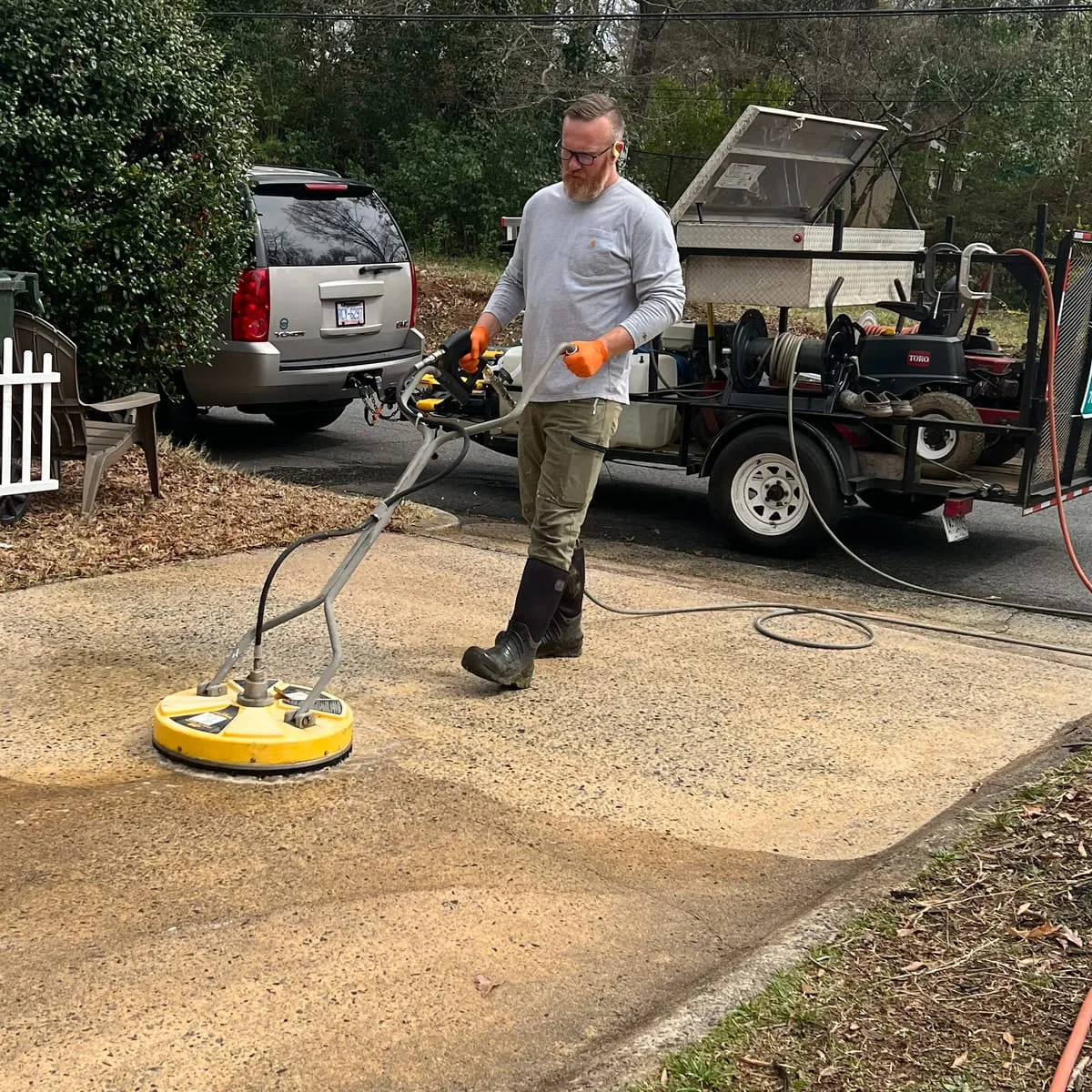 Driveway pressure washing in progress