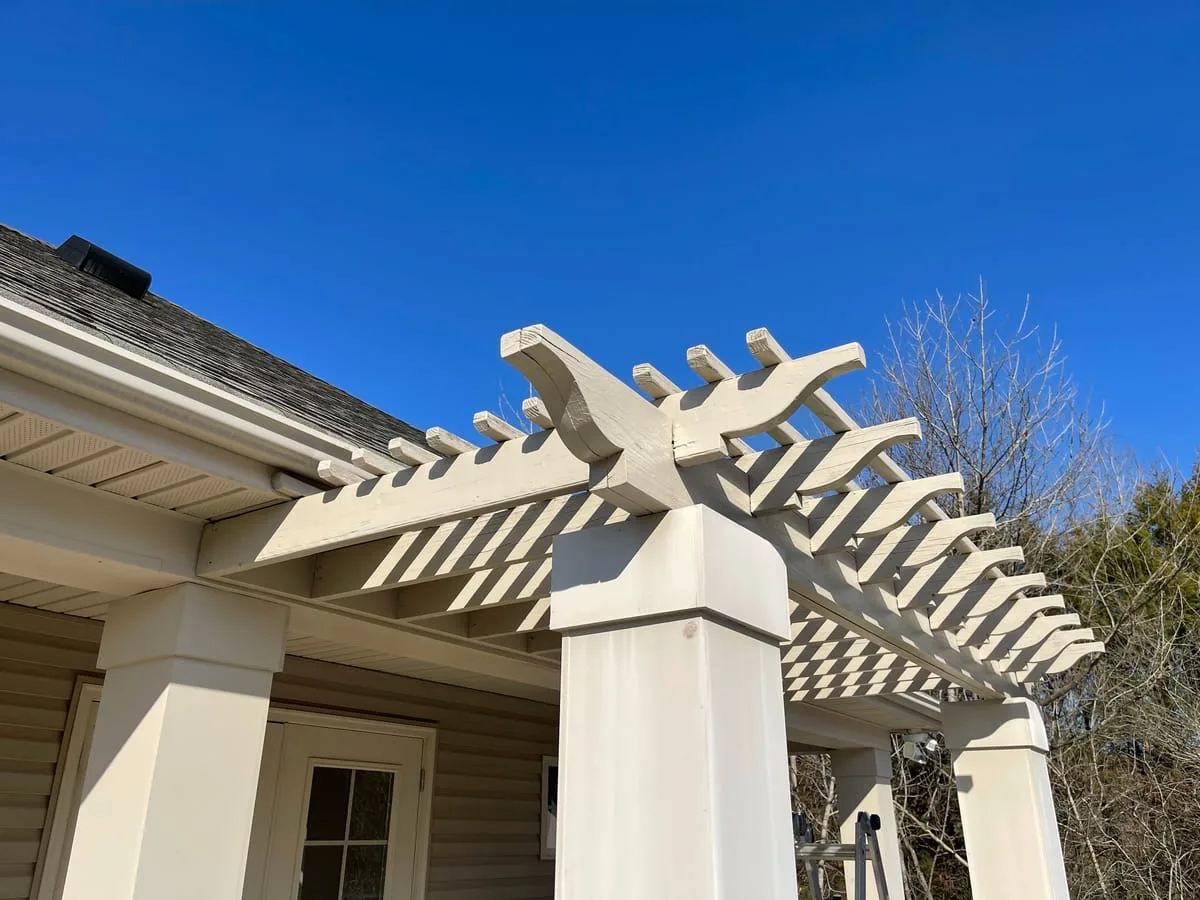 Freshly painted backyard pergola built by Ben Services